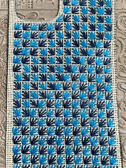 A phone insert with a checkerboard-style pattern. The two shades of blue create a lovely contrast in this custom-made piece.