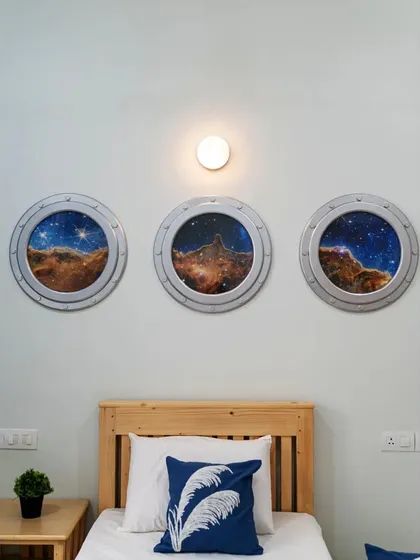 For a young space enthusiast, I designed a cosmic haven. These custom-made portal windows feature high-definition images from the James Webb telescope, offering a view of the Eagle Nebula right from the comfort of a pine wood bed, sparking imagination and wonder.