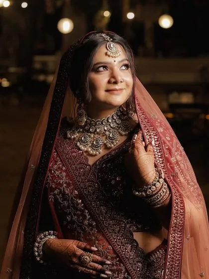 This is my signature bridal style. I created a look that is both radiant and timeless, focusing on luminous skin, softly defined eyes, and a classic lip color. The makeup is designed to look flawless in person and in professional wedding photography, ensuring you look perfect from every angle.