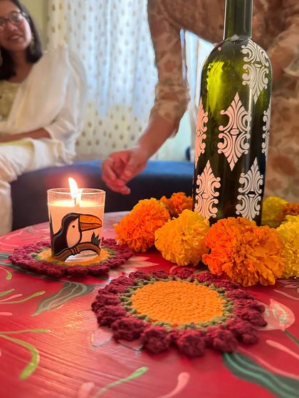 Our quirky toucan-themed shot glass candles, adding a fun and festive touch to a party table setting.