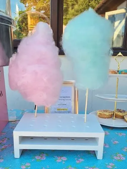 Pink or blue? A close-up of our colorful cotton candy options, ready to be served. We use natural colors to create these vibrant treats.