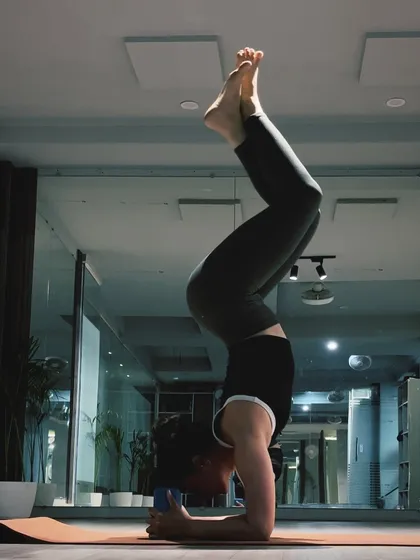 Finding stillness in a forearm stand, or Pincha Mayurasana. This inversion requires a lot of practice to find the right balance point, engaging the entire body from the forearms to the core and toes.