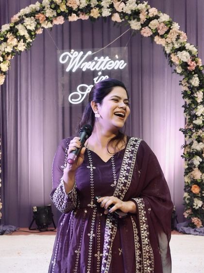 A happy anchor makes for the happiest events. This candid shot captures the pure joy I feel when I'm hosting.