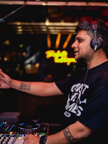 Pointing to the crowd, getting everyone involved. Interaction is a key part of my performance style.