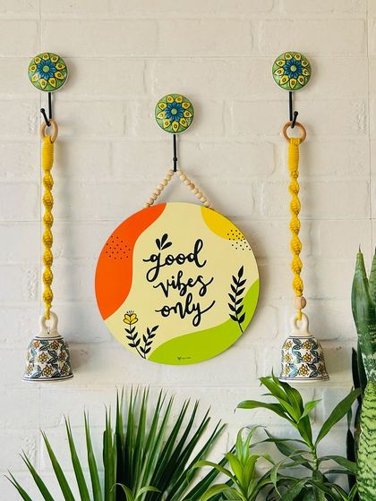 Another one of our six amazing wall setup ideas. This one features our 'Good Vibes Only' wooden hanging, paired with two yellow macrame ceramic bells for a cheerful and positive entrance.