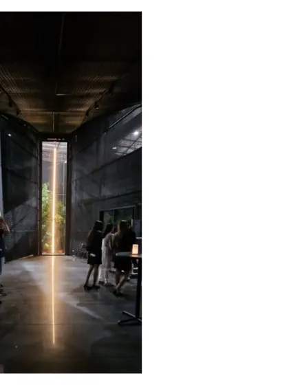The vertical window in the Durall Pavilion frames a "line of light," almost like a temple to a saber. This installation was about creating powerful, emotional moments through architecture.