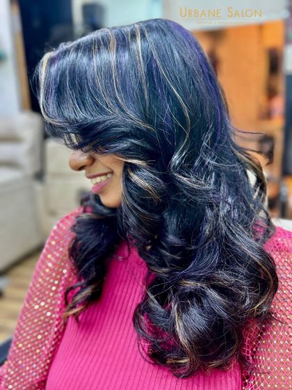 A playful shot showing off the blend of violet and blonde highlights. This is how we do creative colour that is still wearable and chic.