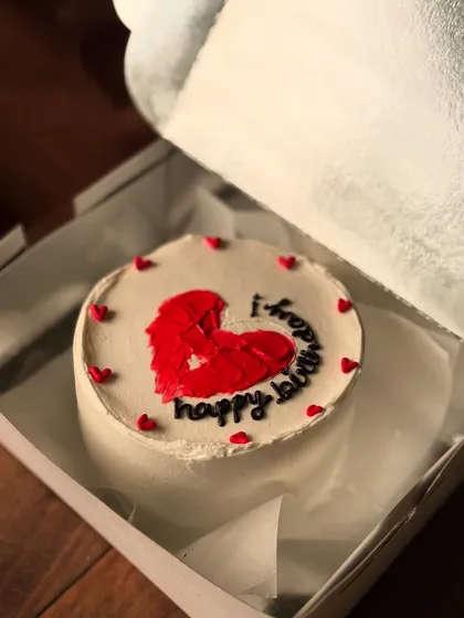 A birthday bento cake with a broken heart design, showing a more edgy and modern aesthetic.