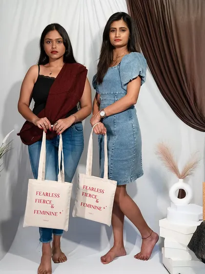 Bold women deserve bold statements. My friends modeling our custom tote bags, which are more than an accessory; they're a celebration of strength and style.