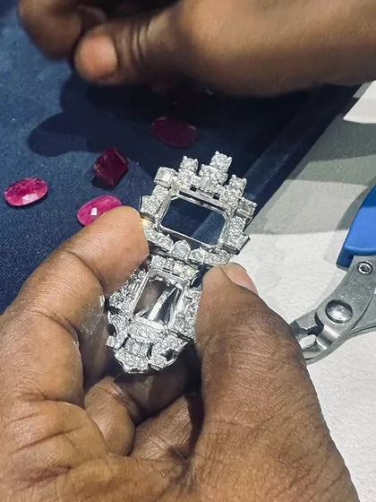 A close-up of the hands that craft our pieces. There is no greater beauty than that of true craftsmanship, setting each stone with purpose and precision.