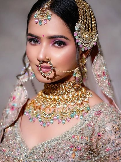 This shot captures the complete look, from the stunning jewelry to the expertly applied makeup. She looks every bit the modern, elegant bride.