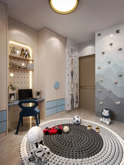 This angle reveals a mini climbing wall and a dedicated study area, showing how the room is designed to encourage both active play and learning.