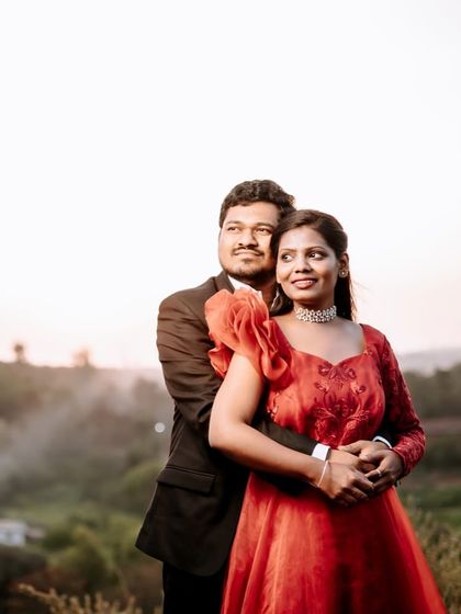A classic couple's embrace during their maternity shoot. The warm color of the gown complements the soft light of the golden hour.