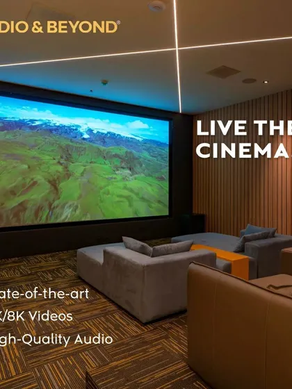 We believe in creating spaces where you can truly live the cinema. This modern media room features a massive 4K screen, plush, comfortable seating, and integrated ceiling lights, all designed to deliver a state-of-the-art, high-quality audio and video experience.