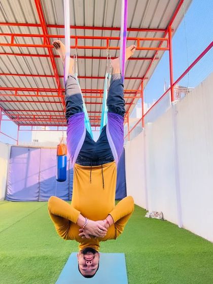 Just hanging out. This supported inversion in the aerial hammock is a great way to release tension in the neck and back after a long day.