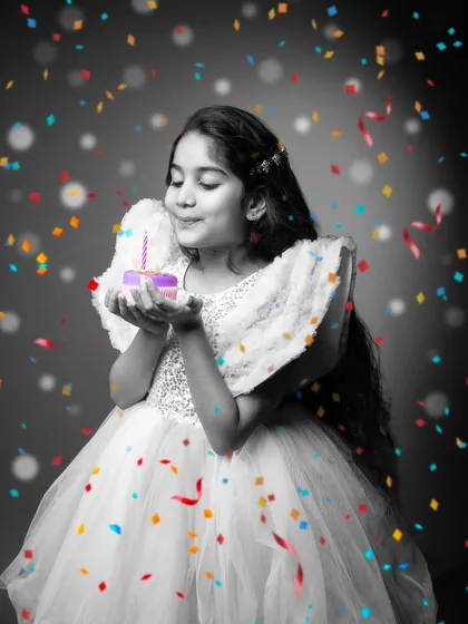 A birthday wish is a moment of pure magic. I used a special editing technique here, keeping the girl and her wish in focus while the world around her is in black and white. The colorful confetti adds a touch of whimsy, highlighting the joy and wonder of her celebration.
