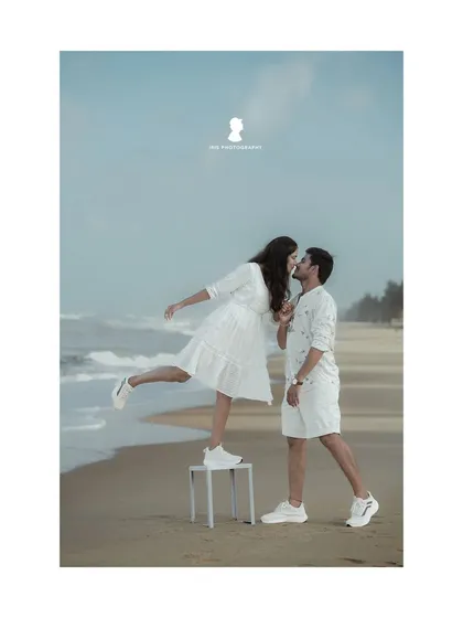 A fun and creative pose from the beach session. Using a simple stool adds a playful and unique element to this pre-wedding kiss.