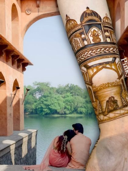A creative shot blending the groom's mehndi, which features a monument from their story, with a real photo of the couple at that location.