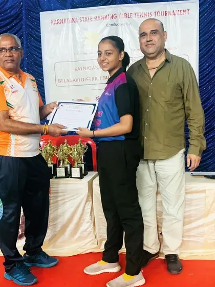 Sahana H Murthy receiving her certificate at the Belagavi district State Ranking Tournament where she won the U17 title.