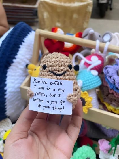 Here's my 'Positive Potato' out and about at a pop-up market. It’s always so rewarding to see people smile when they read the little motivational message it holds.