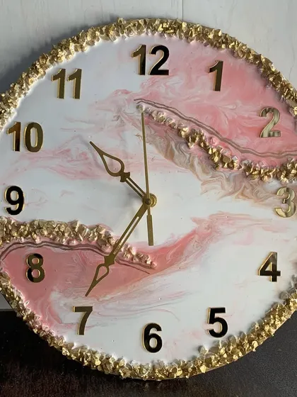 Another view of the pink and white marble clock, showing the beautiful depth of the colors.