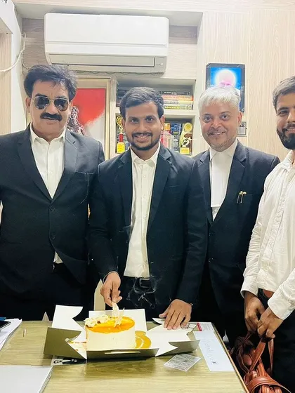 A group photo during a birthday celebration in the chamber. These moments of camaraderie strengthen our professional relationships.