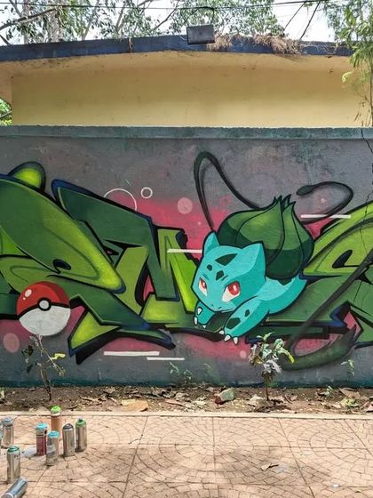 A wild Bulbasaur appeared. I painted this piece featuring the classic Pokémon, blending my graffiti letters with the character. This shows how I can integrate beloved, nostalgic characters into a custom street art design.