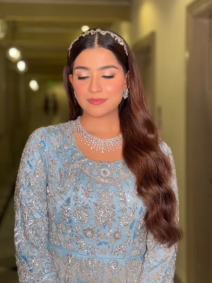 An ode to old-world charm and soft elegance. This look in a celestial blue gown is perfect for a reception, with muted tones, delicate shimmer, and a quiet grace.