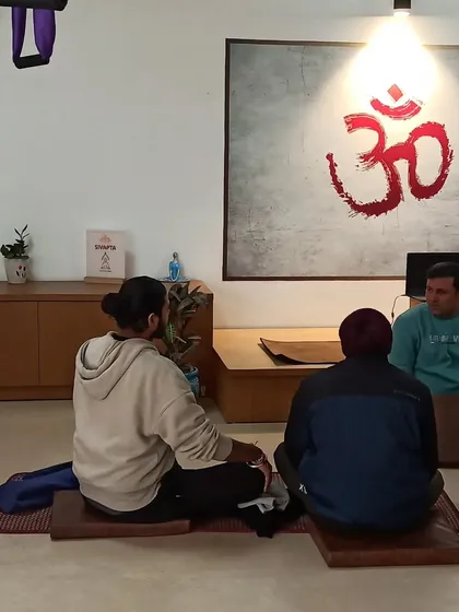 A small group discussion during a break in our workshop. These moments of connection are important for building a supportive network of fellow yoga therapists.