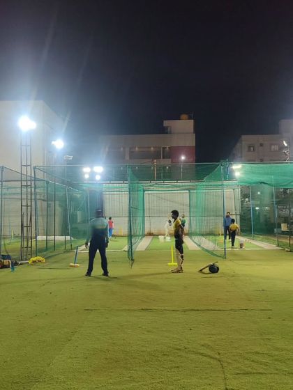 Our nets are always active with players honing their skills. This image captures the atmosphere of dedication and hard work that defines our academy.