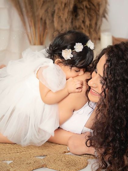 The sweetest hug between a mother and her baby girl. These candid, loving moments are what our sessions are all about.