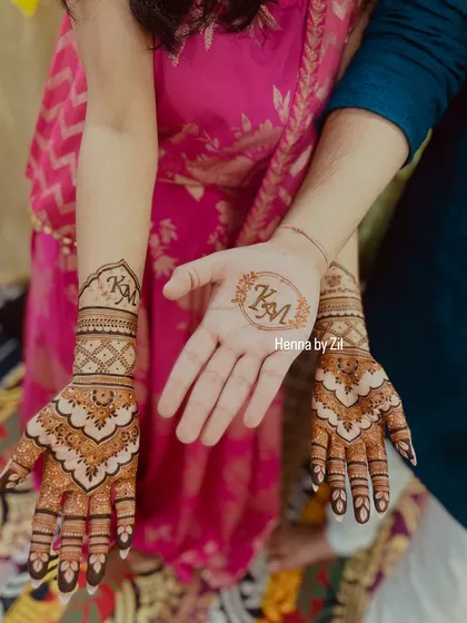 A sweet and simple way to personalize your mehendi. We included the couple's initials in a beautiful motif on both the bride's and the groom's hands.