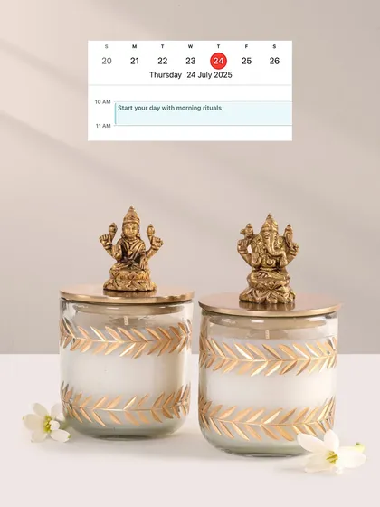 Scent can be a form of prayer, a way to create a sacred space. This set of two spiritual candles, featuring beautifully crafted Laxmiji and Ganeshji idols on the lids, is designed for your morning rituals or as a thoughtful gift of prosperity and peace. The golden leaf pattern on the glass adds a touch of divinity.