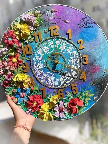 This 22-inch galaxy-themed wall clock shows how we can play with unique concepts. The deep blues and purples of the background are complemented by a burst of colorful 3D flowers, creating a functional piece of art that is truly out of this world.