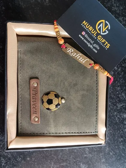 A personalized denim wallet in olive green with a football charm, paired with a custom name rakhi for the festival.