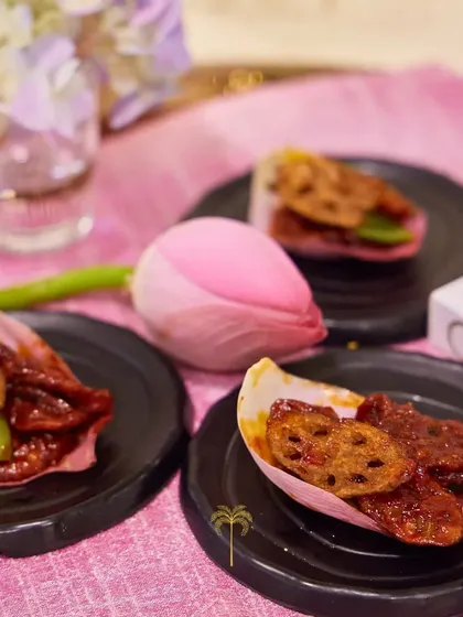 A unique appetizer featuring crispy lotus root chips served in a delicate lotus petal. This dish is a beautiful blend of texture, flavour, and artistic presentation.