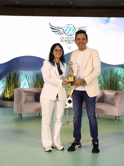 Receiving an award from my mentor. Celebrating milestones is a key part of the author's journey.