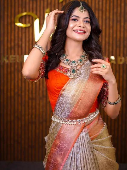 A closer look at the styling for Sanjana. The perfectly pleated saree complements the stunning jewelry and allows for a clean, sophisticated look.