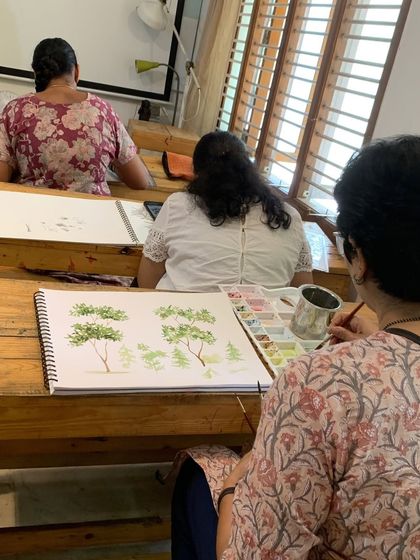 The back of the classroom shows students fully engaged in their work. This is a space where you can unwind, learn something new, and create art you'll be proud of.