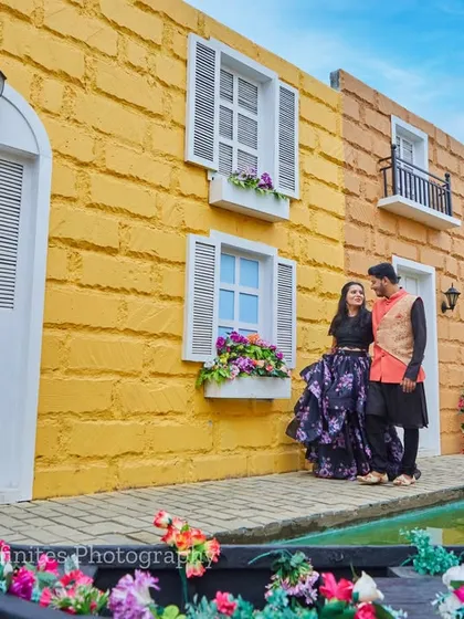 This couple, dressed in elegant traditional wear, brings an Indo-Western fusion feel to their pre-wedding shoot at our Venetian canal set.