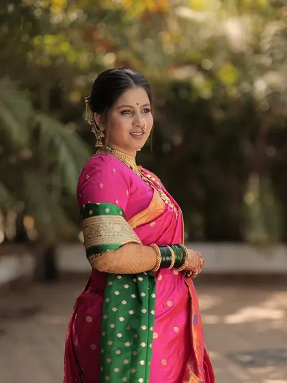 A candid side portrait of the bride in an outdoor setting.