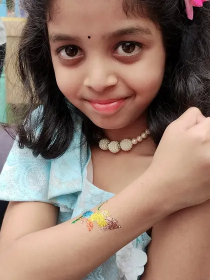 A happy smile from a guest with her new multi-colored butterfly tattoo. I love creating these rainbow effects that make the designs even more eye-catching.