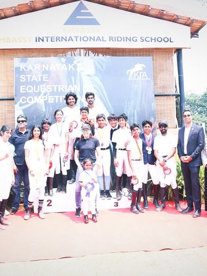 A large group of my riders and their supporters celebrating a massive medal haul at the Karnataka State Equestrian Competition. Winning is a team effort.