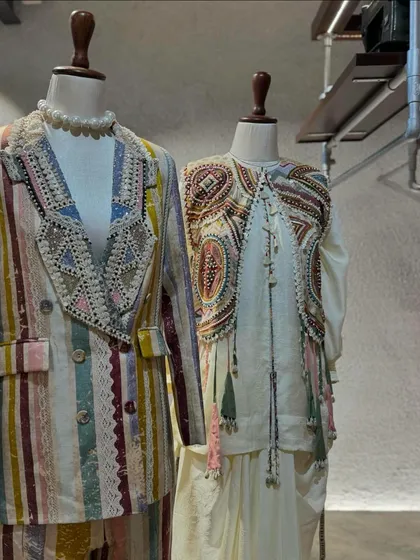 Aseem Kapoor's 'Mural' collection is a work of art. This display features a multi-color striped pantsuit and an intricately embroidered vest.