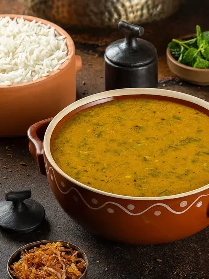 A simple yet elegant presentation of dal with steamed rice for Punjab Grill.