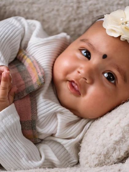 A beautiful portrait of a 3-month-old baby. I focus on capturing their emerging personality and sweet expressions during these early milestone sessions.