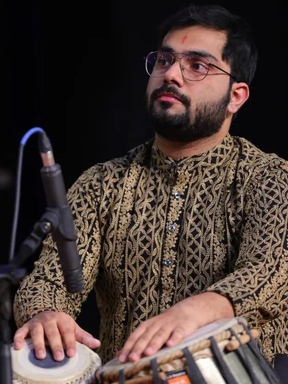 This image captures the intensity and focus required during a live classical concert.