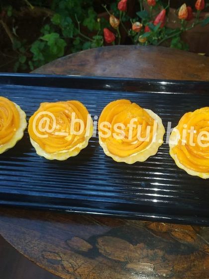 A close-up of my Mango Rose Tartlets, showcasing the detailed arrangement of the mango slices.