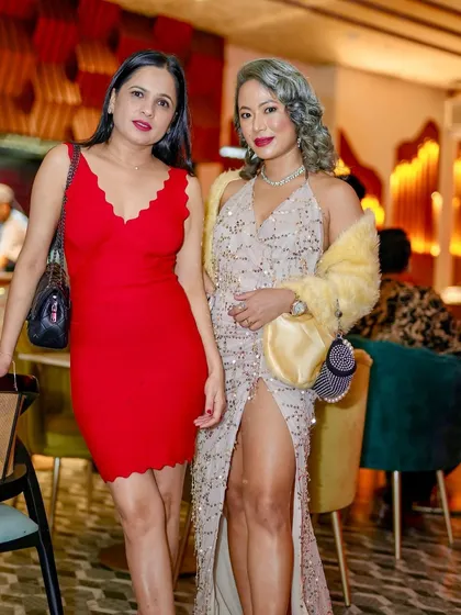 Guests in stunning outfits at 'THE RED DANCE' Halloween event.