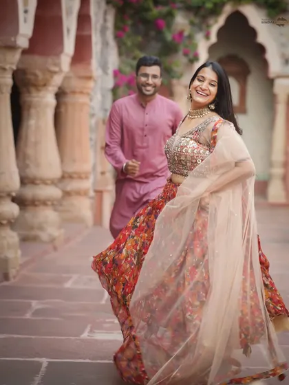 The best moments are the unscripted ones. The pure joy in her laughter and the movement in her lehenga capture the vibrant, candid energy I strive for in every shoot, set against a beautiful heritage backdrop.